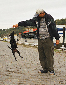 Met this fisherman and his little dog one early weekday morning while wandering around Prague before the city started waking up.  Wish I spoke Czech so I could have learned more about them — or at least the little guy's name. (2003)