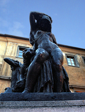 Digitally composited photo of Prague statue of seductress and her panther.  (2003)