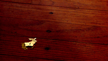 Errant foil reindeer found on the floor of my office in the wee hours of the morn'.  Take a look at the larger version (link below).  (2005)