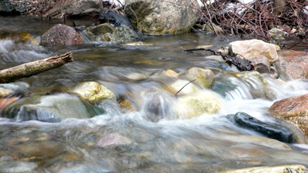 My favorite shot of a little creek up in the Utah mountains.  Notice the glassy sheen of the water splashing over the rocks.  I wanted to use that effect since I read about it a while ago.  (2006)