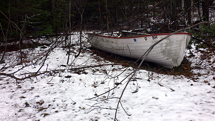 My grandfather's old boat resting in the snow on the edge of the woods near the barn.  (2007)