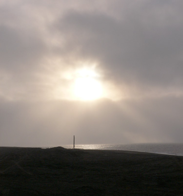 Another sun-breaking-through-the-clouds picture from Barrow, Alaska.  (2007)