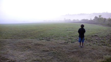 Alex in the early morning at The Lake Bottom facing the fog.  (2008)