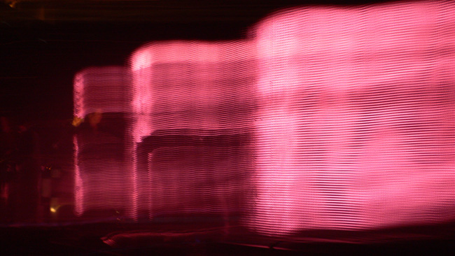 Pink waves caused by leaving the shutter open too long and waving the camera in a creative fashion during the Nine Inch Nails concert in Jacksonville.  (2008)